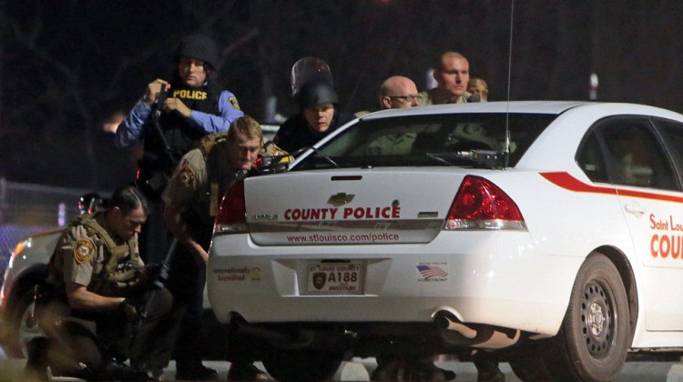 268EC4D000000578-2991014-Taking_cover_Officers_from_multiple_St_Louis_police_forces_were_-a-34_1426149553797