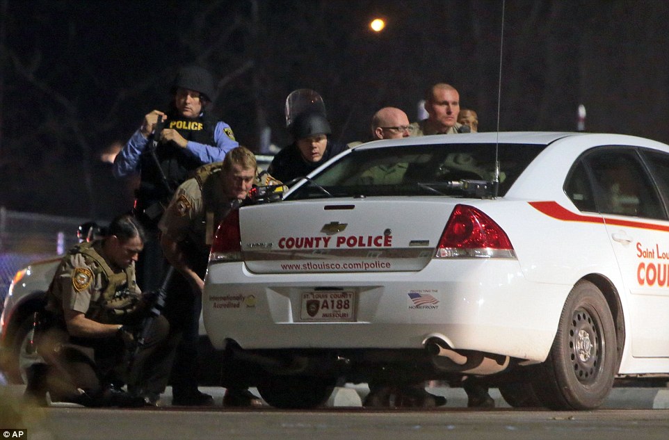 268EC4D000000578-2991014-Taking_cover_Officers_from_multiple_St_Louis_police_forces_were_-a-34_1426149553797